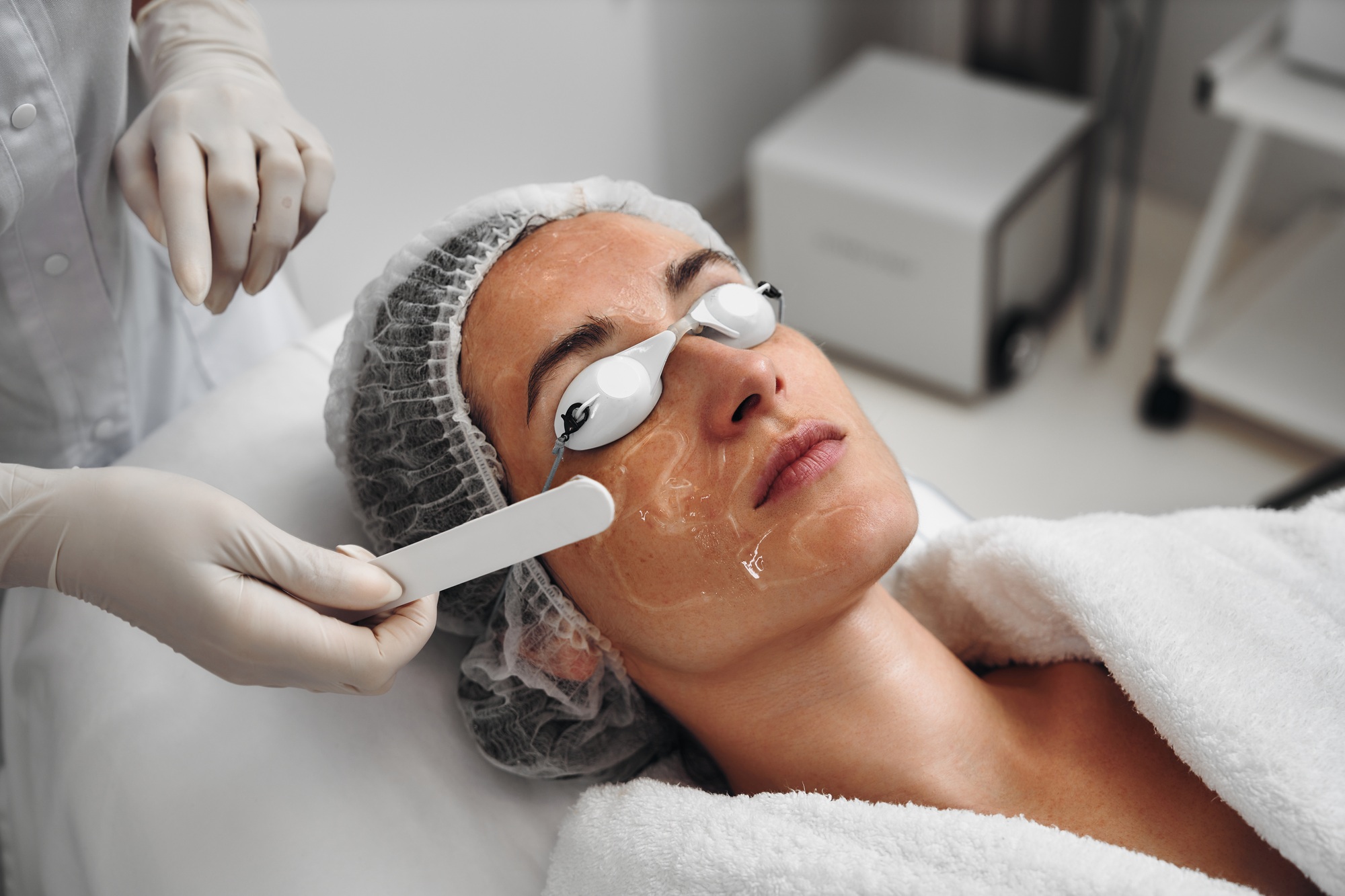 A woman receives IPL therapy in a beauty salon.
